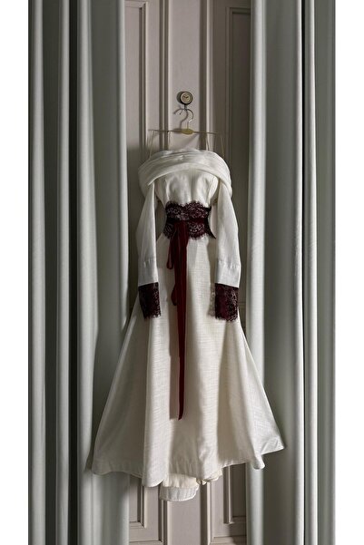 Meryl Ivory evening dress with a burgundy lace belt, off-the-shoulder style