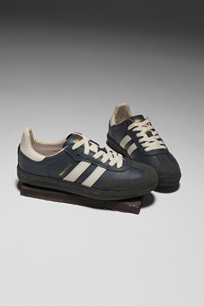 Tonny Black حذاء رياضي للجنسين من الجلد المدخن مع شريط جانبي ورباط