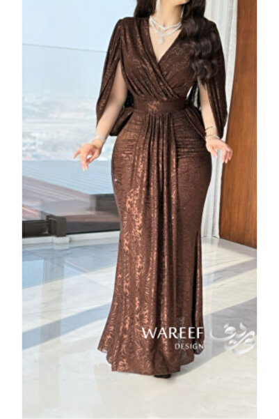 WAREEF FASHION A luxurious brown dress with a delicate pattern and a sophisti...