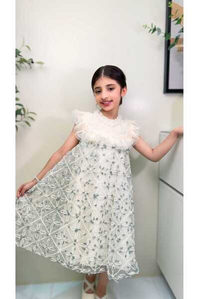 gmax Girls' dress decorated with geometric patterns and floral motifs