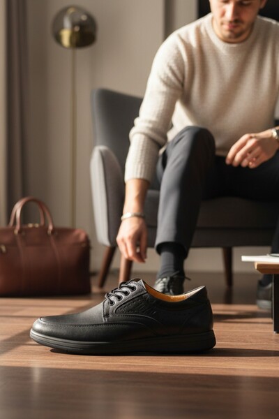 enoch حذاء رجالي من الجلد الطبيعي باللون الأسود مع تفاصيل مطرزة بالليزر لتقوي...