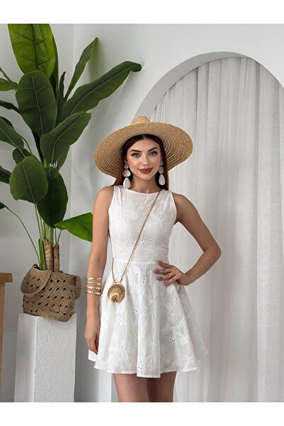 MODA DURAĞI ÇİÇEK DESENLİ CEP DETAYLI MİDİ ELBİSE beyaz