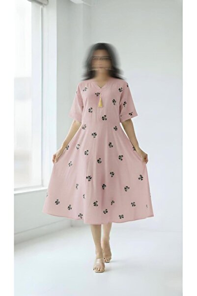 ISHRAQAT AL-AMAL A short dress with short sleeves, a half-circle design, and ...