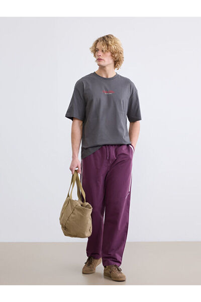 LC Waikiki Rmz Gi̇yi̇m Farkiyla Comfortable Fit Ba Printed Men's Sweatpants B...