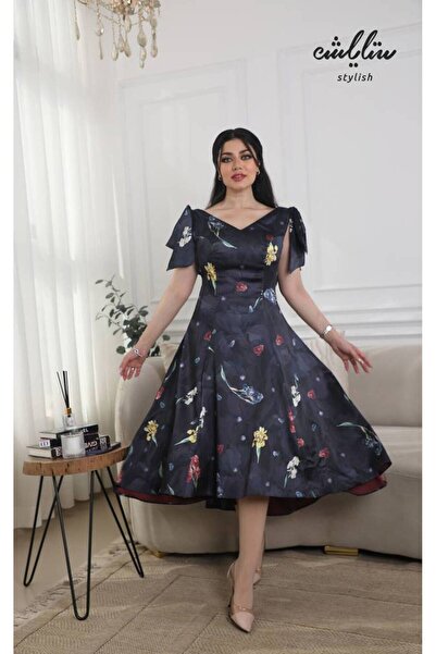 Stylish Stylish satin midi dress with a floral bow on the shoulders