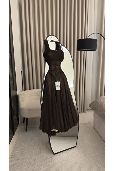 Nareen Fashion An elegant brown dress with a sophisticated design that reflec...