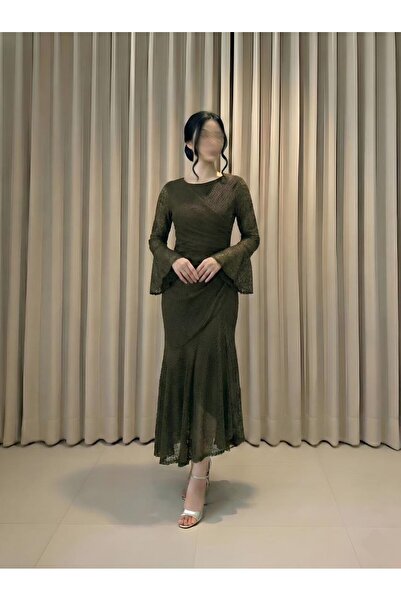 WOW An evening gown that embodies sophistication in its deep olive green hue,...