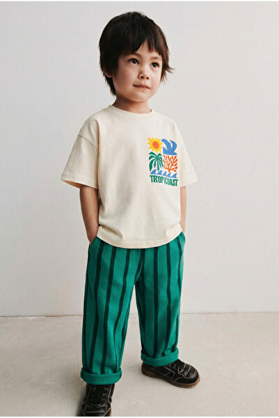 Magu Дитяча бавовняна бежева футболка з принтом та зелений смугастий спортивн...