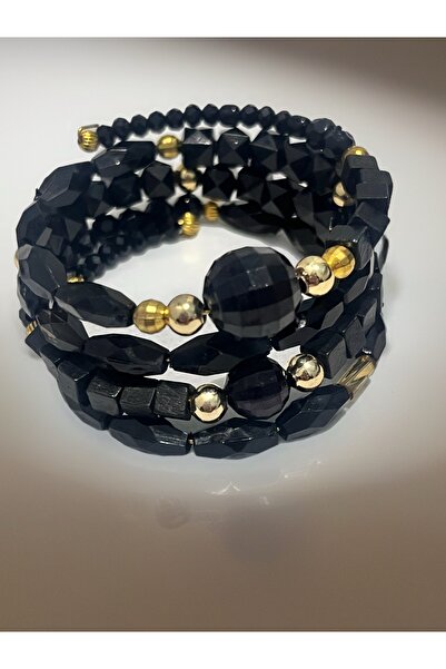 COCOSH TAKI Black beaded bracelet with gold accents and a multi-wrap design.