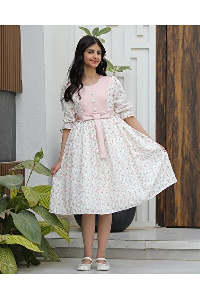 Totikids Girls' pink floral dress with a modern waist bow and unique design |...