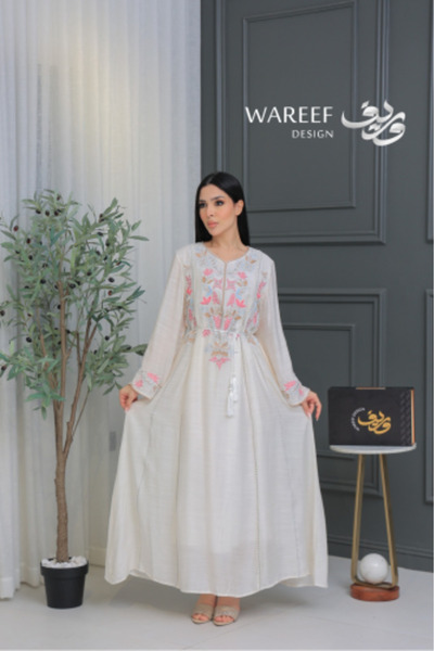 WAREEF FASHION Off-white jalabiya with delicate pink embroidery and a flowing...