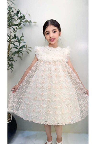 gmax Girls' dress decorated with geometric patterns and floral motifs