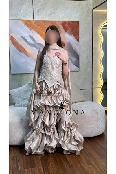 MANGONA Champagne "corset" evening gown adorned with pearls and featuring a t...