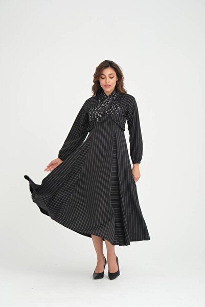 Stylish Black striped dress with a soft cut on the chest