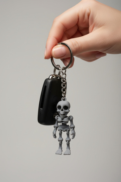 Pazarois Gülümseyen İskelet Figürlü Hareketli Anahtarlık Gri