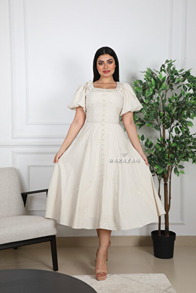 Warazan A soft dress with embroidery and a sheen
