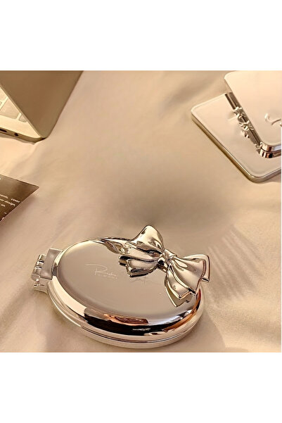 Choice مشط شعر صغير محمول فضي اللون على شكل فيونكة - شعيرات نايلون قابلة للطي...