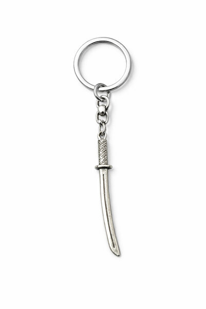 HER ŞEY NOTA www.herseynota.com Breloc cu figurină metalică în formă subțire