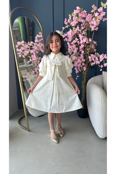 Warazan A dress with a bow detail on the chest