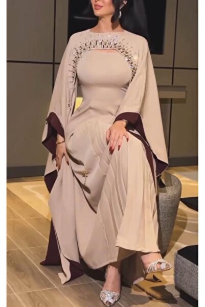 Mira Barbie evening dress adorned with hand embroidery, featuring a distincti...