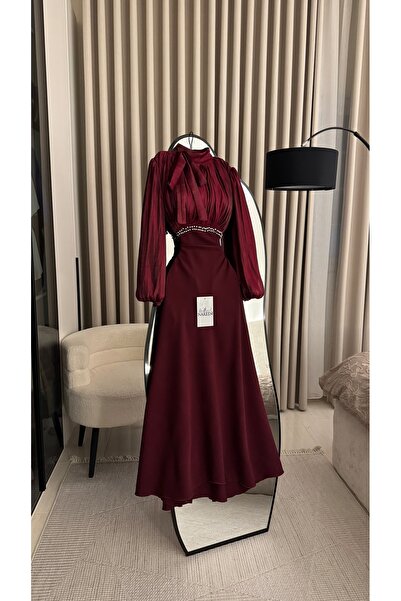Nareen Fashion An elegant burgundy dress that combines luxury and softness, w...