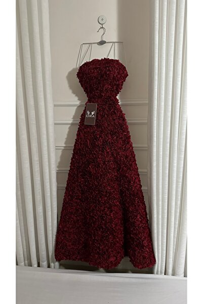 Ora A burgundy dress with rose embellishments and a flared skirt.