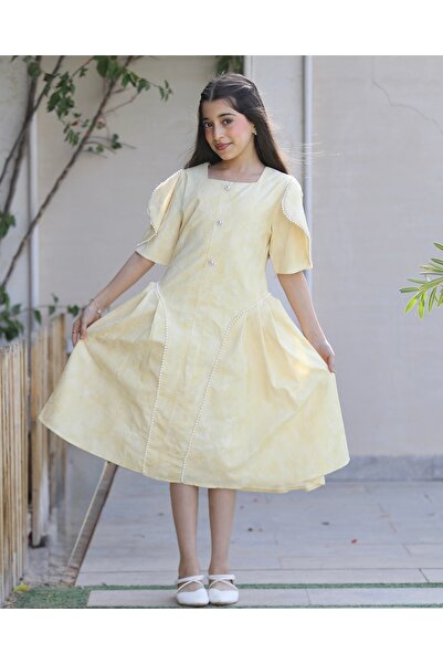 Totikids Girls' yellow patterned dress with pearl-studded butterfly sleeves -...