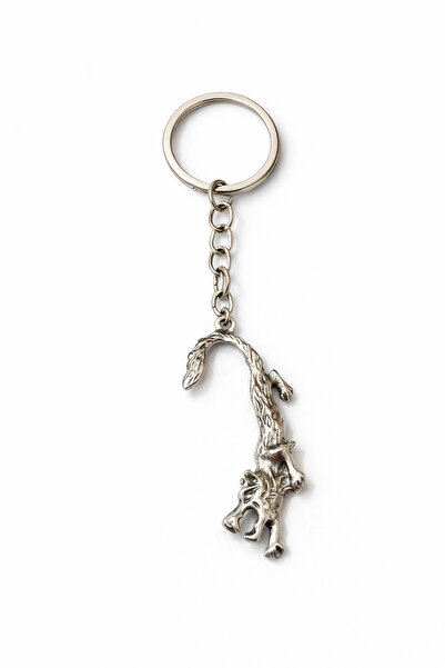 HER ŞEY NOTA www.herseynota.com Breloc din metal cu figură abstractă curbată