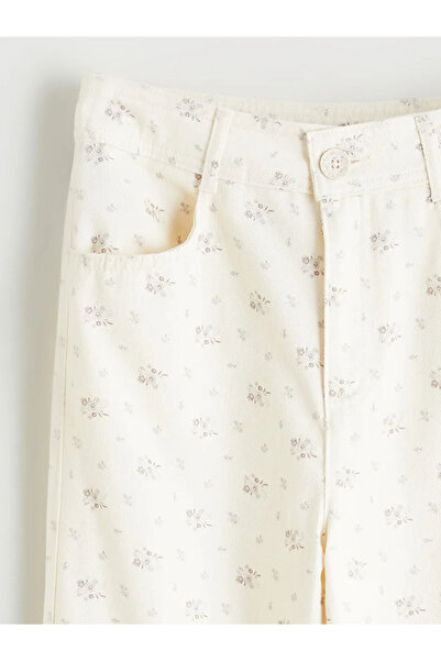 LC Waikiki LCW Kids bež pantalone sa zvonastim nogavicama i cvetnim uzorkom z...