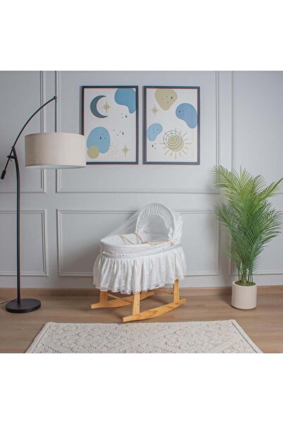 My Baby A straw Moses basket bed with a cotton fabric cover trimmed with lace...