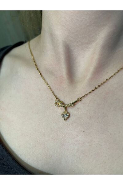 uyguntakıaksesuar قلادة نسائية ذات لون ذهبي مع تفاصيل حجرية وشكل قلب ورمز الل...