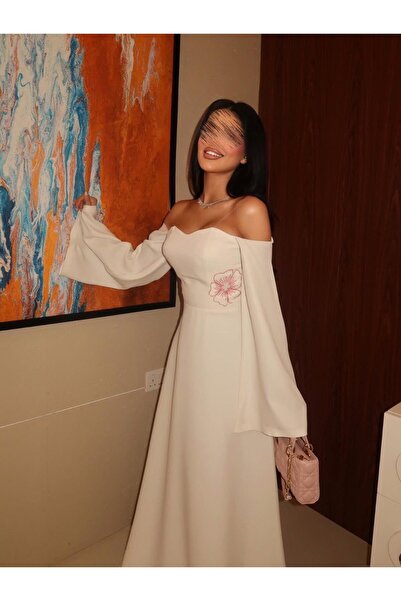 Special-DIARA A pristine white off-the-shoulder evening dress