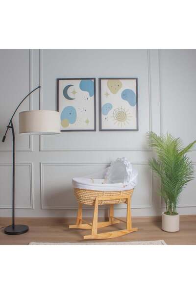 My Baby A straw Moses basket bed with an off-white linen cover and a wooden f...