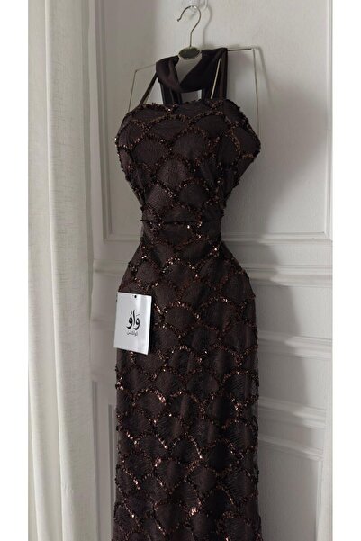 WOW An evening dress that embodies luxury with a modern touch, designed in br...