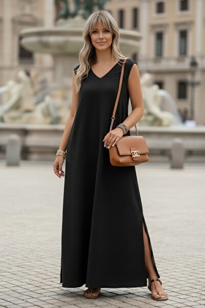 Mossta فستان ماكسي بدون أكمام بقصة فضفاضة وياقة على شكل حرف V - أسود