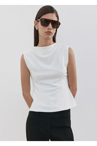 MANGO Woman Peplum omuz vatkalı tişört