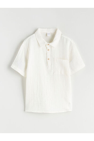 LC Waikiki ملابس لا تتأثر بمرور الزمن وقميص للأولاد بأكمام قصيرة بجيوب من تيم...