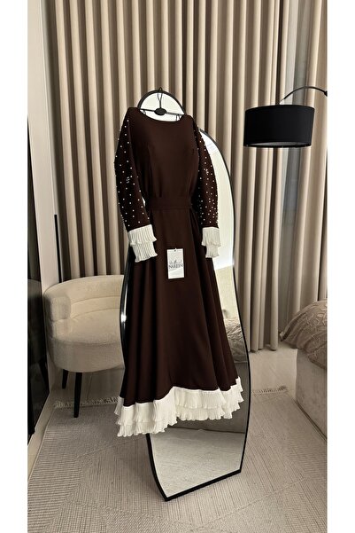 Nareen Fashion An elegant dress in a warm chocolate brown color, with a long ...