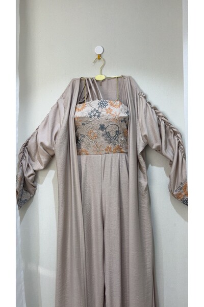 dalaa Overalls with a beige abaya