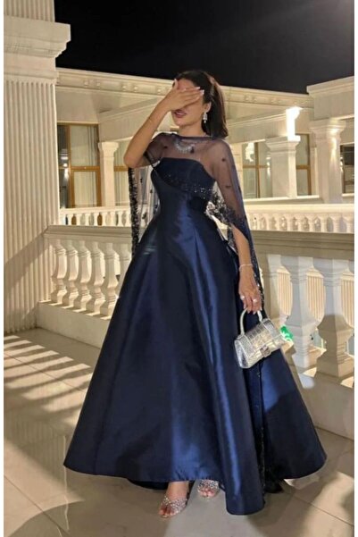 Mira An evening gown in sequined mica dopash fabric that is not just a piece ...