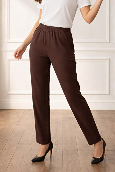 Curly Коричневі ткані штани з морквою