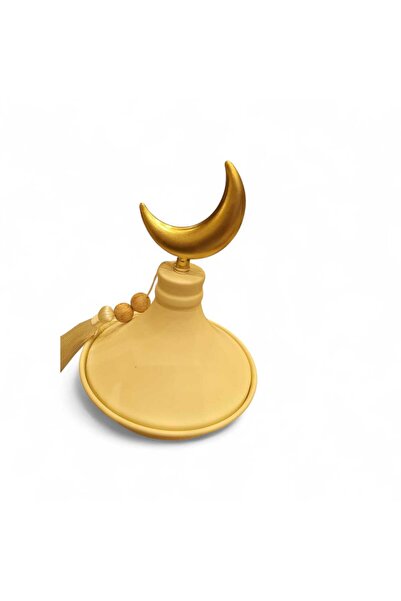 Noor This is a golden-colored date dish (tamriya) with a Ramadan design.