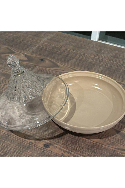 Generic A glass serving dish for sweets or dates with a beige base and lid.