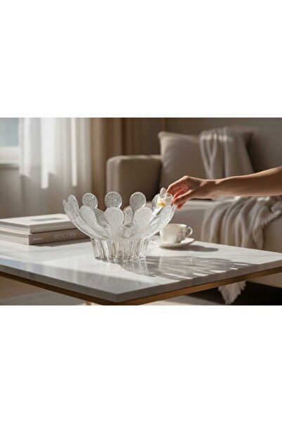 Generic A glass dish for serving fruits or desserts with a unique design.