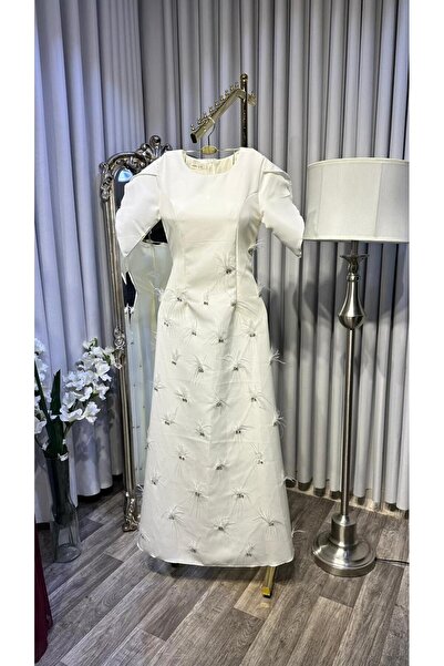 NORA KSA Barbie dress embroidered with crystals and feathers