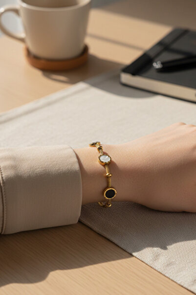 takimaster سوار من الفولاذ المطلي بالذهب مع أرقام رومانية باللونين الأسود وال...