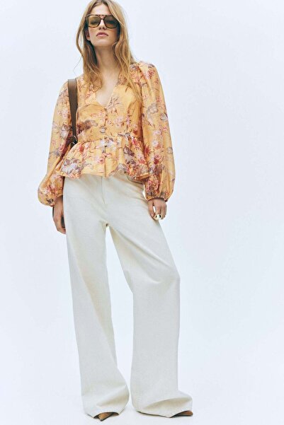 H&M بلوزة بيبلوم من مزيج الكتان