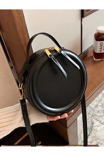 The Casius. The Casius mini round bag, crossbody, minimalist design, black, 2...