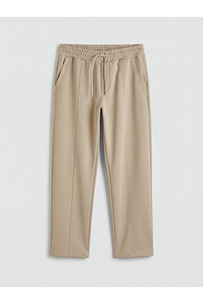 LC Waikiki Ανδρικό αθλητικό παντελόνι σε μπεζ χρώμα κανονικής εφαρμογής από τ...