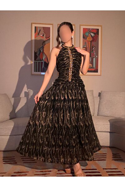 salsa-dresses A soft, feather-like dress in black and gold